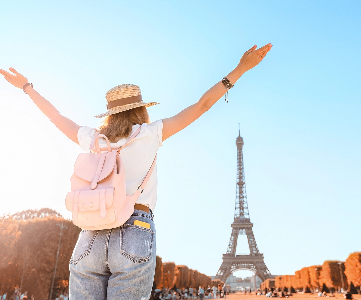 A woman wearing a hat exploring France